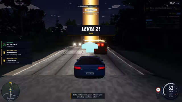 The same road at night, headlights on